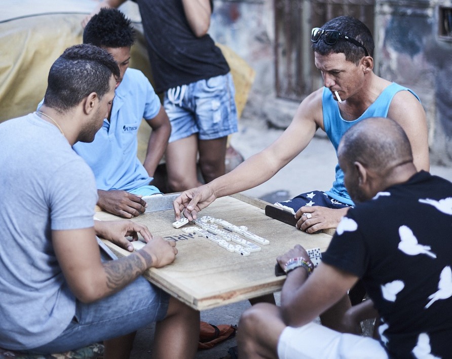 Cubans playing dominoes in the neighborhood.