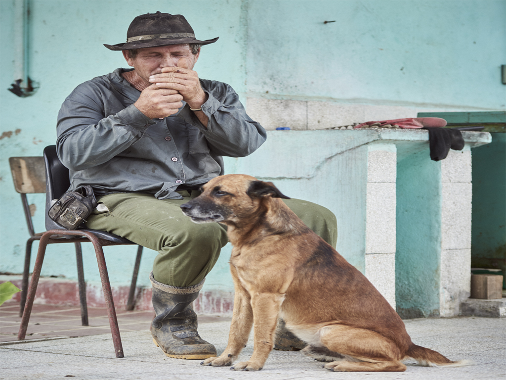 an old man with his dog