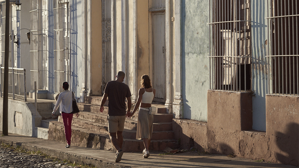 Couple walking in Cienfuegos street